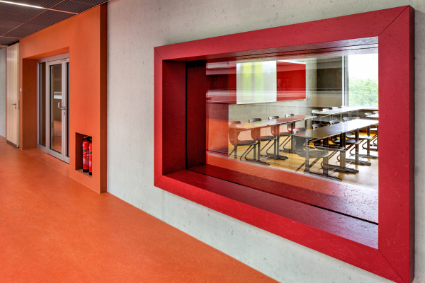 View from the corridor into a classroom via the built-in interior windows