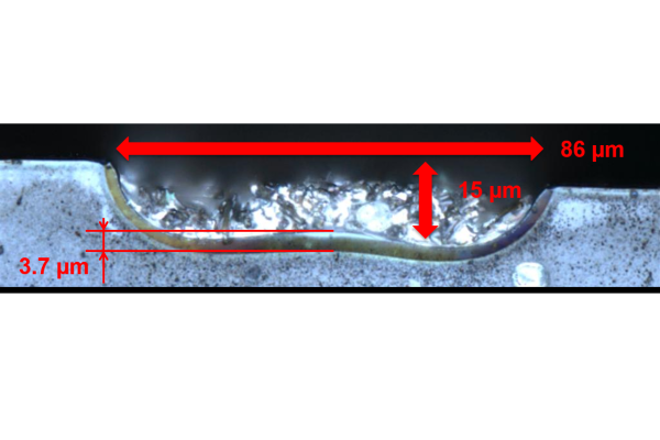 The optical microscope image shows the cross-section of a local emitter area formed by aluminium paste when aluminium paste is printed across the entire surface.