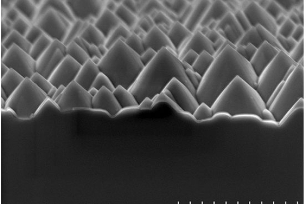 The SEM image shows the small pyramids of the textured surface of silicon wafers.